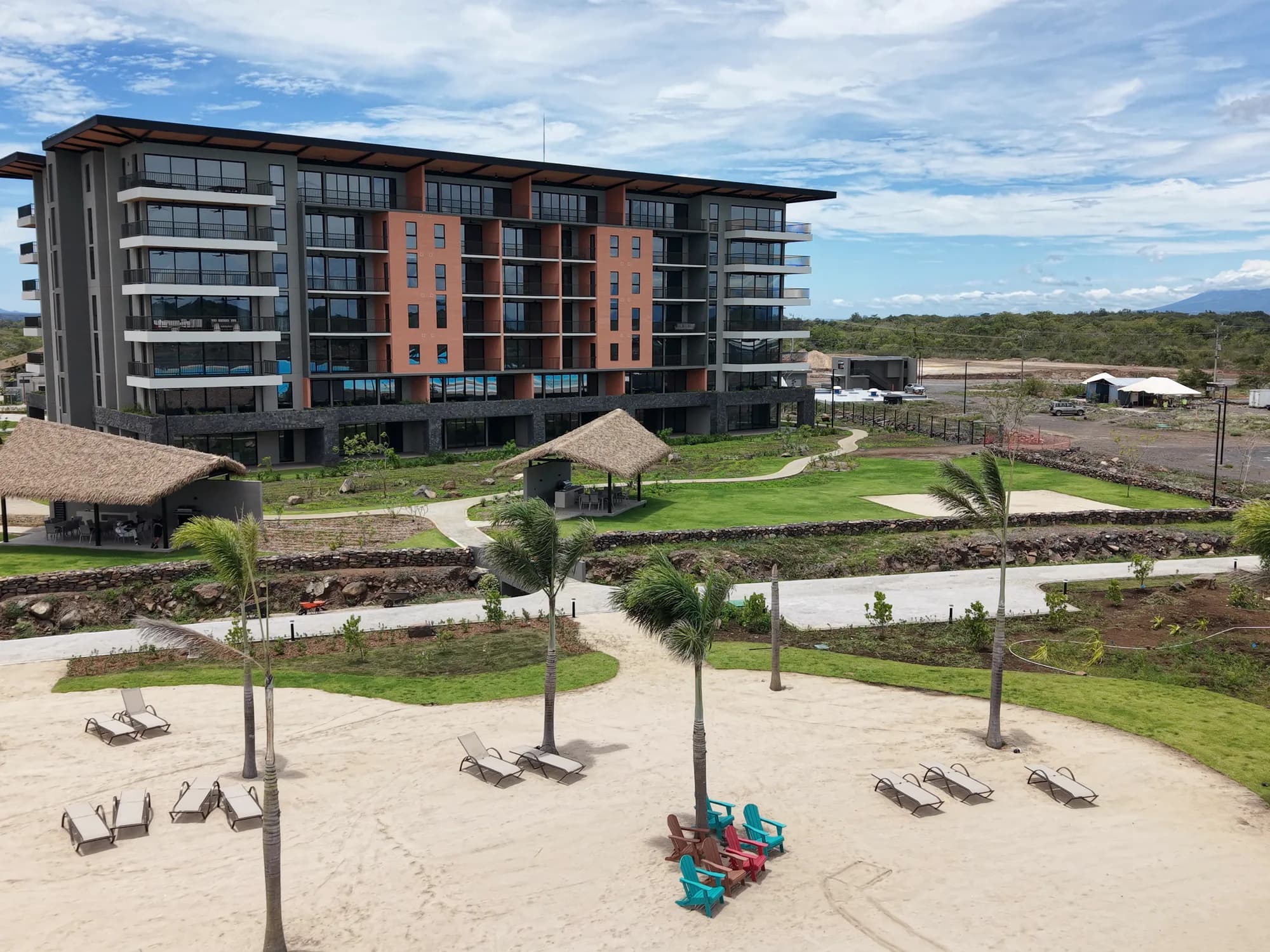 Beach club: palapa, palms and loungers by the lagoon