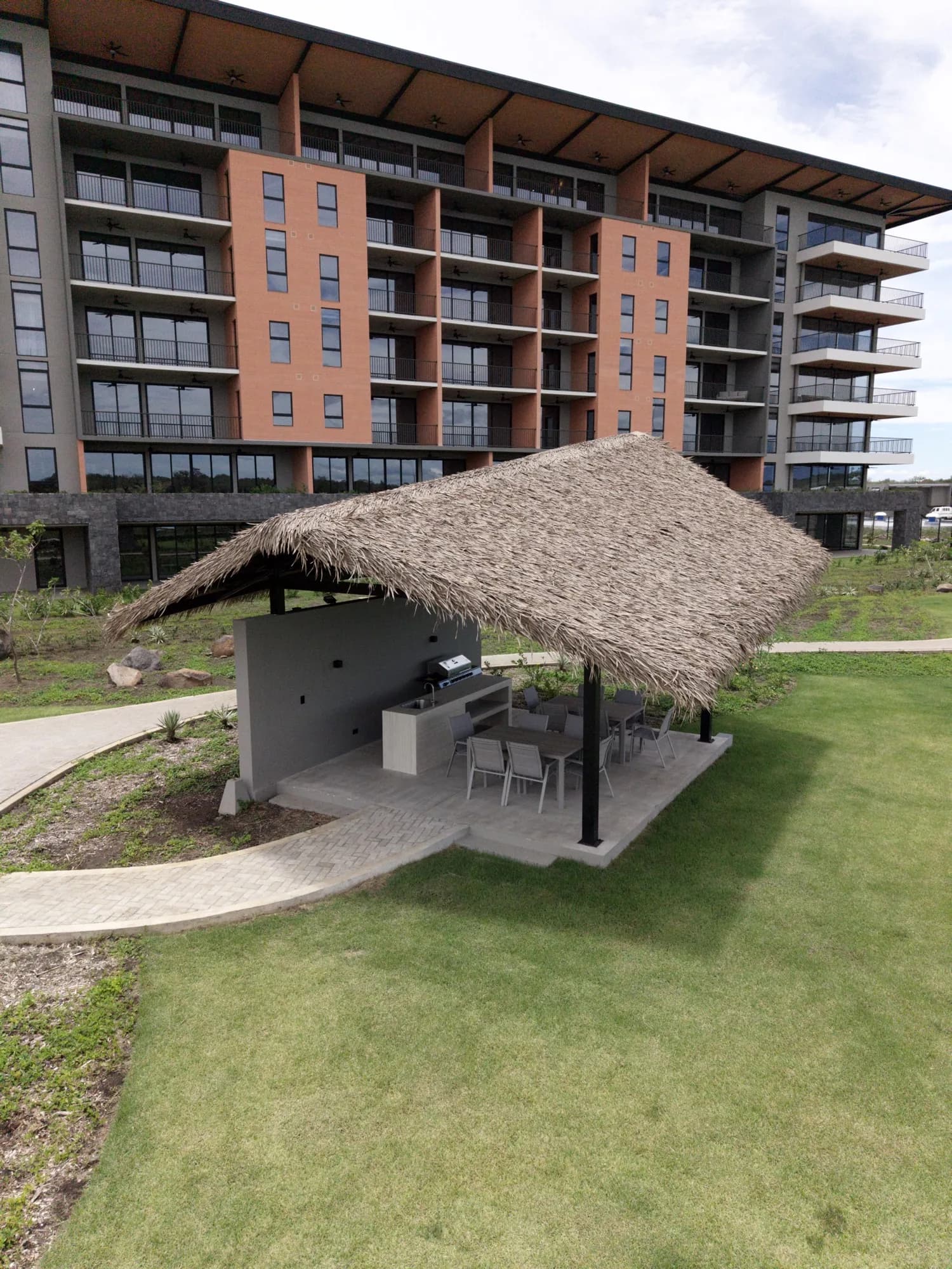 Palapa with bar and grill in front of the tower